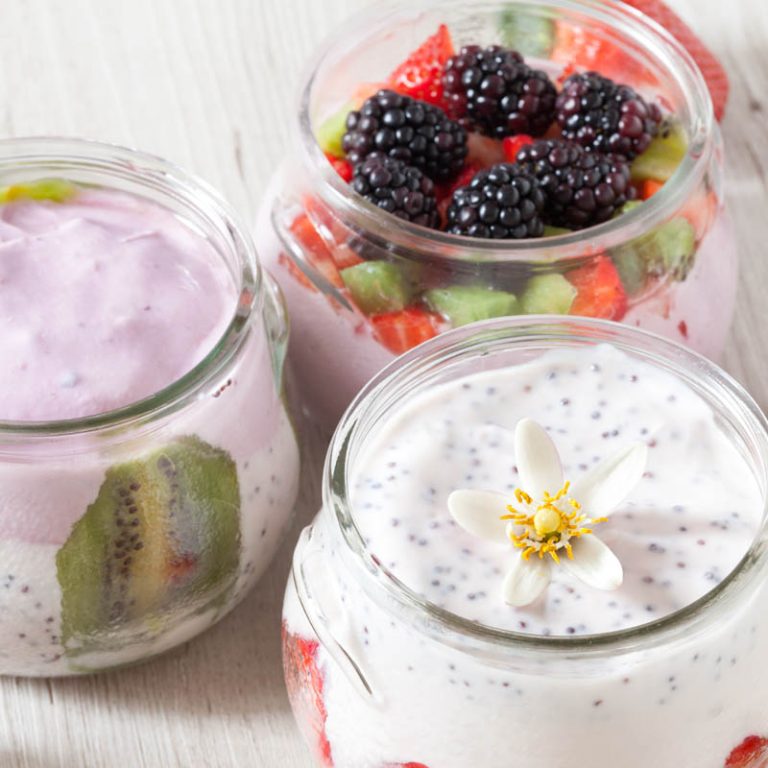 Breakfast with yogurt and soft fruits: blackberries, strawberries and kiwi.